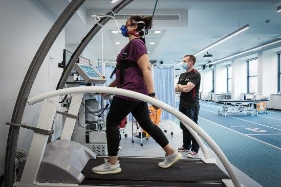 woman using a treadmill while undergoing vo2max testing