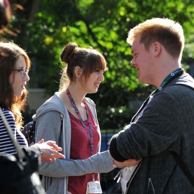 students talking to each other out in the sunshine