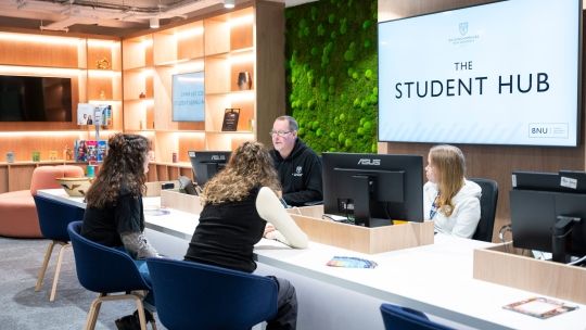 Students and staff in Student Hub