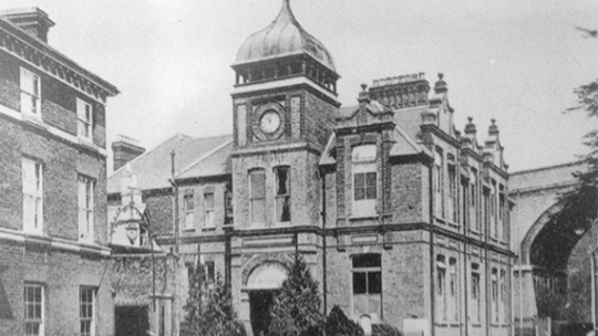 Historic black and white photo of the outside of a now BNU building