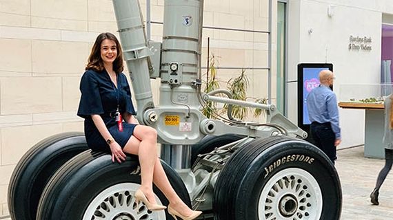 Sarah Clarke sat on an airplane tyre at British Airways offices