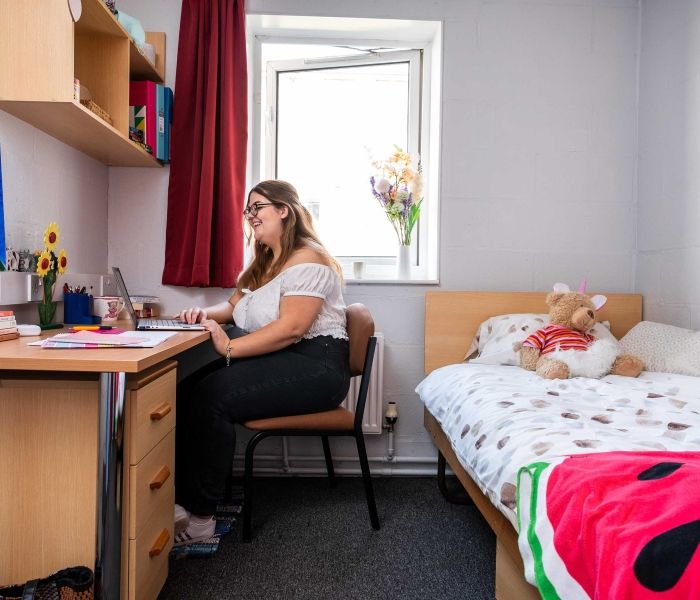 A student working at her desk in a Brook Street bedroom