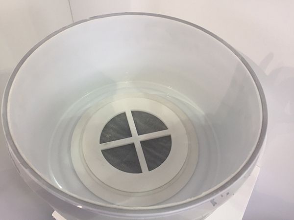 A water filter within a lid of a cup